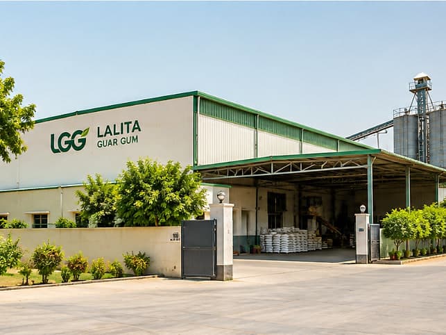 A guar processing unit with covered loading bays and storage silos